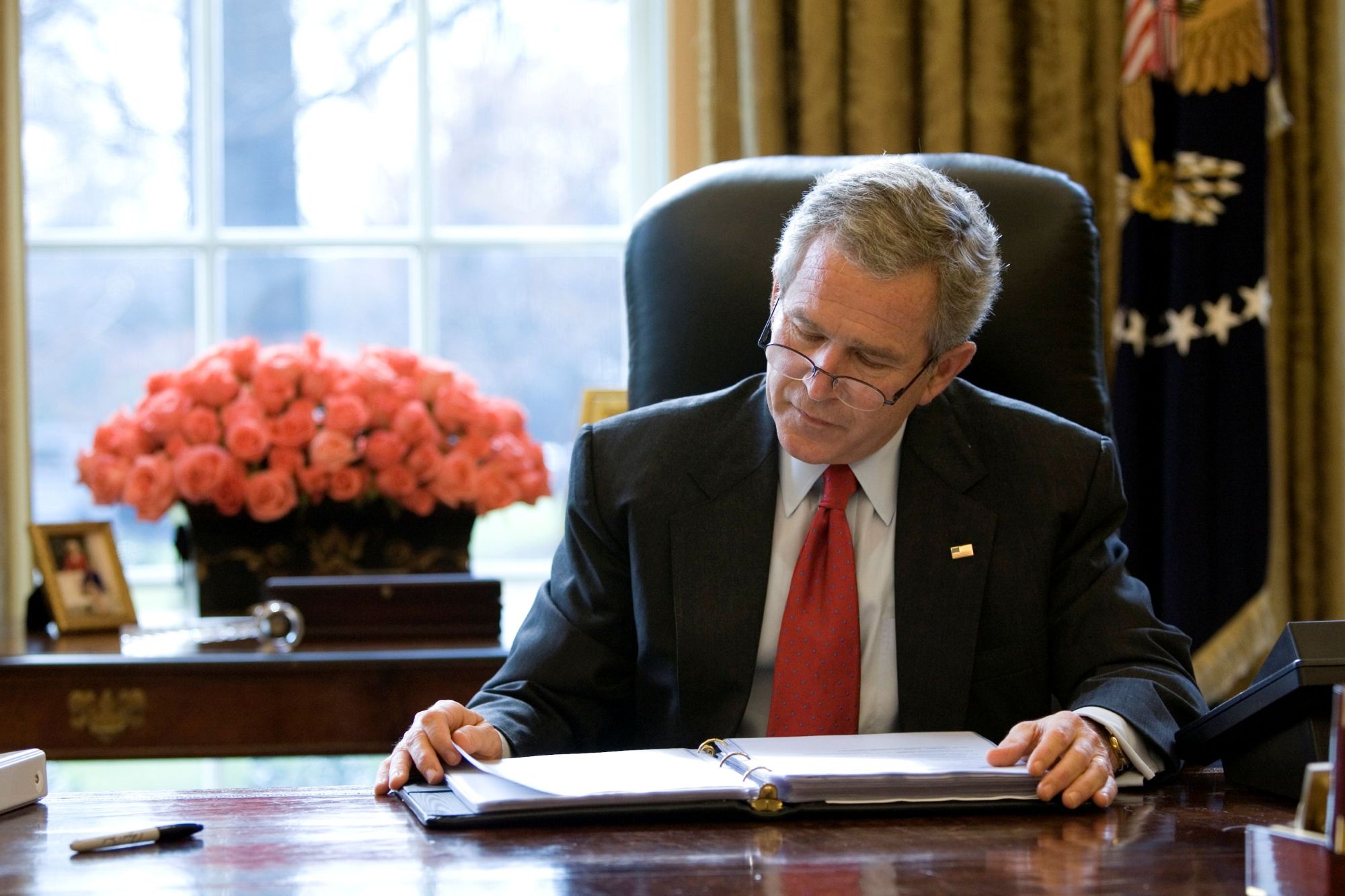  President George W. Bush reads over a draft of his State of the Union speech in the Oval Office Tuesday morning, January 31, 2006, in preparation for the annual address to the nation scheduled for that evening.