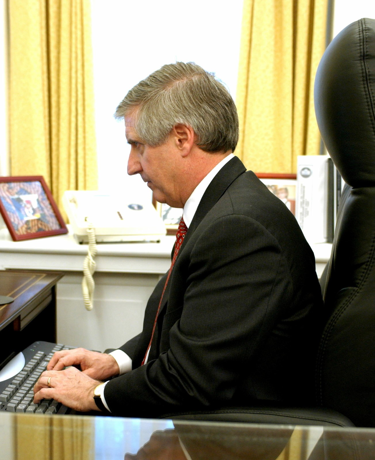 Chief of Staff Andy Card working at his desk.