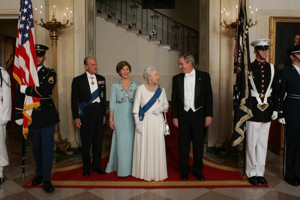 President George W. Bush and First Lady Laura Bush escort Her Majesty Queen Elizabeth II and His Royal Highness The Prince Philip, Duke of Edinburgh, from the Grand Staircase of the White House, May 7, 2007, prior to attending the State Dinner in the Queen's honor. (P050707JB-0692)