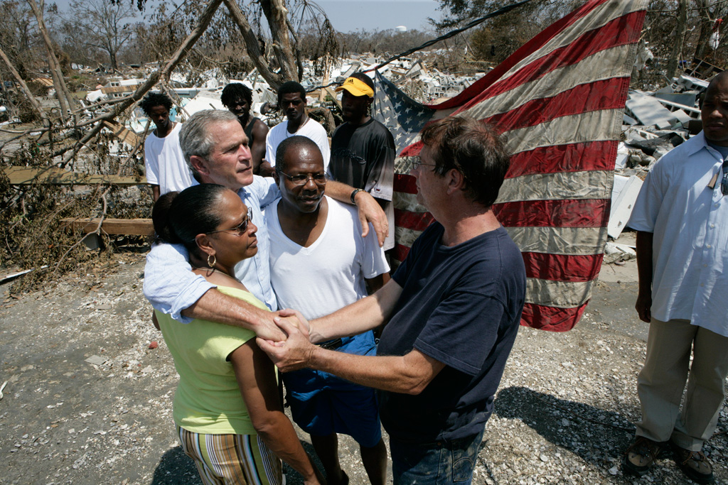 President George W. Bush embraces victims of Hurricane Katrina September 2, 2005, during his tour of the Biloxi, Mississippi, area. (P090205ED-0726)