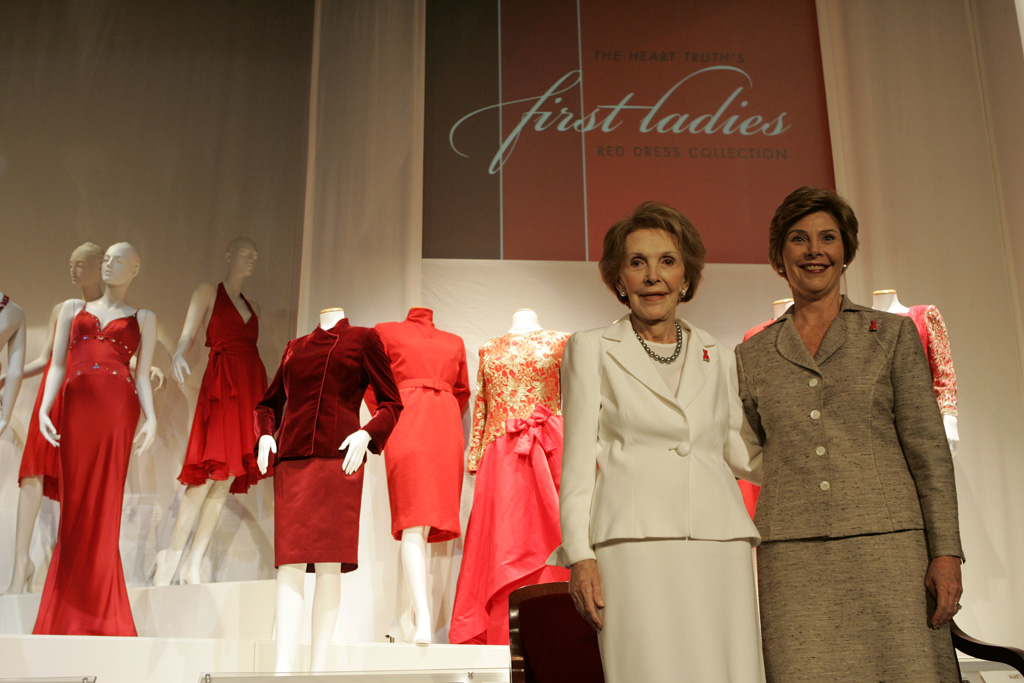 Mrs. Laura Bush and Mrs. Nancy Reagan appear at the opening, May 12, 2005, of The Heart Truth's First Ladies Red Dress Collection exhibit at the John F. Kennedy Center for the Performing Arts in Washington D.C. (P44867-138)