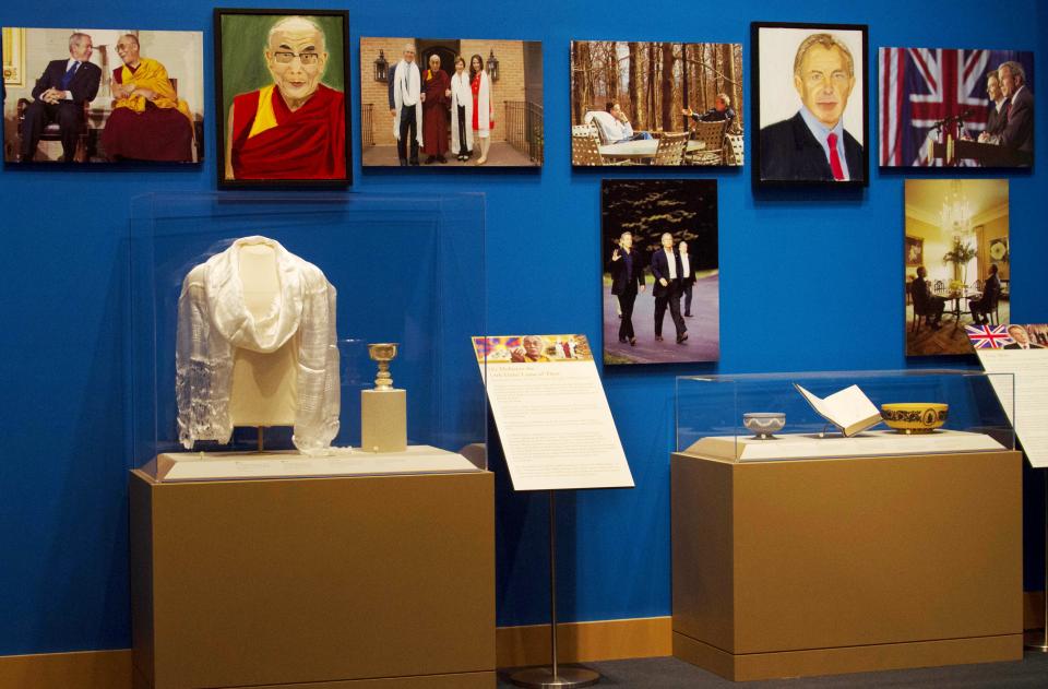 A picture of displays featuring the Dalai Lama and Prime Minister Tony Blair, from the  2014 exhibit The Art of Leadership: A President's Personal Diplomacy, at the George W Bush Library and Museum