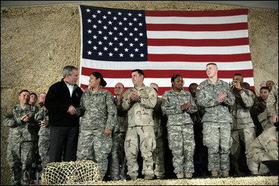 President George W. Bush meets and thanks a group of U.S. and Coalition troops, March 1, 2006, during a visit to Bagram Air Base in Afghanistan, where President Bush thanked the troops for their service in defense of freedom.