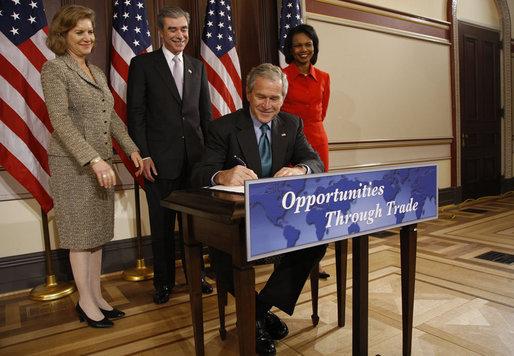 President George W. Bush signs the Andean Trade Preference Act Extension.