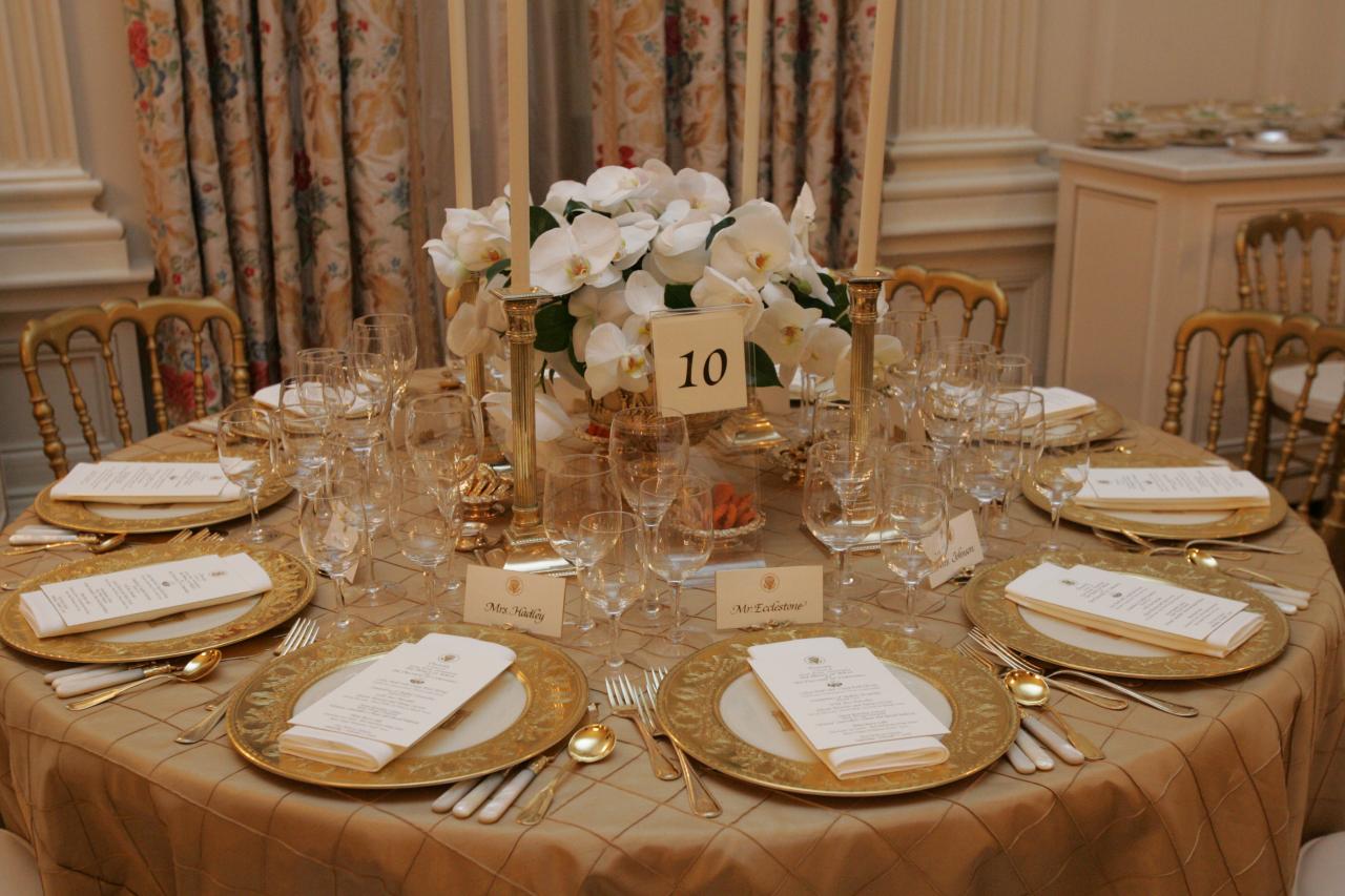 Table settings in the State Dining Room for the White House dinner in honor of the Prince of Wales and Duchess of Cornwall, November 2, 2005.