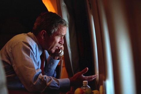 After departing Offutt Air Force Base in Nebraska, President George W. Bush confers with Vice President Dick Cheney from Air Force One, September 11, 2001, during the flight to Andrews Air Force Base. (P7091-18)