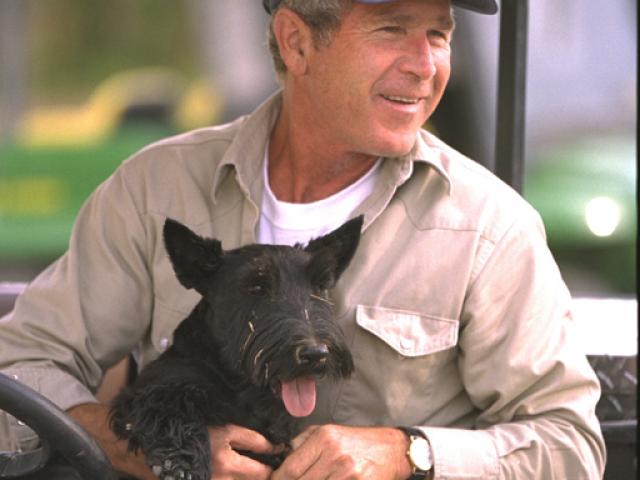 President George W. Bush sits with Barney, August 27, 2002, at Prairie Chapel Ranch in Crawford, Texas. (P20871-12A)