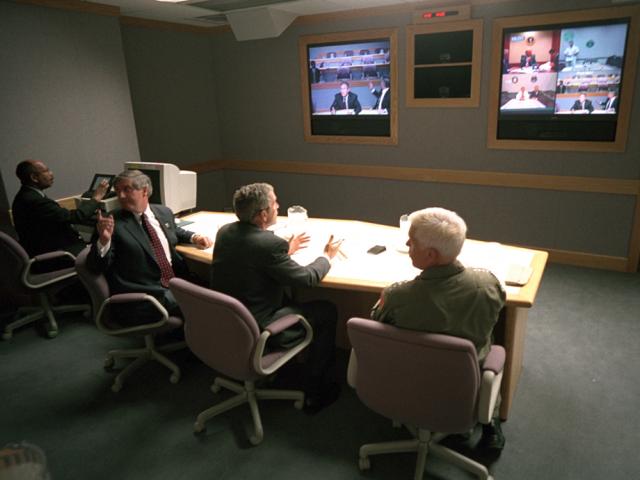 President George W. Bush, White House Chief of Staff Andy Card (left) and Admiral Richard Mies conduct a video teleconference, September 11, 2001, at Offutt Air Force Base in Nebraska. (P7093-16)