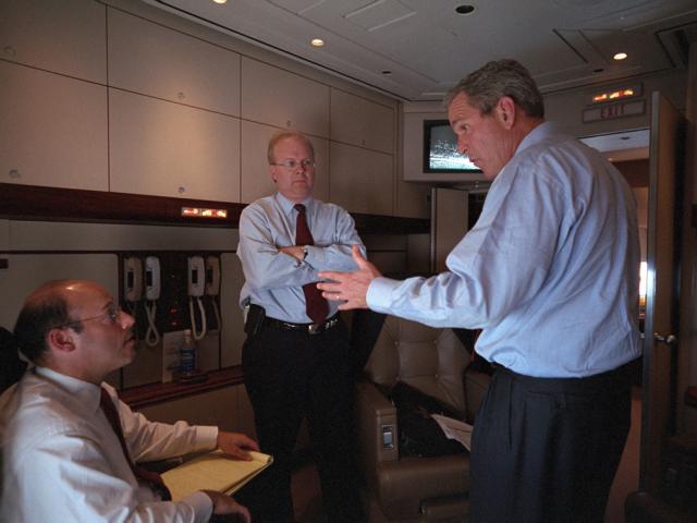 President George W. Bush speaks with Karl Rove (center) and Ari Fleischer, September 11, 2001, aboard Air Force One during the flight from Offutt Air Force Base in Nebraska to Andrews Air Force Base. (P7098-06)