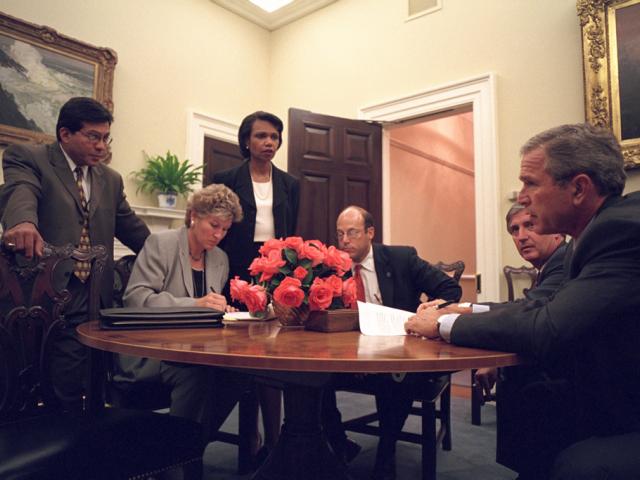 President George W. Bush immediately gathers his senior staff in the Private Dining Room, September 11, 2001, after returning to the White House. (P7111-27a)