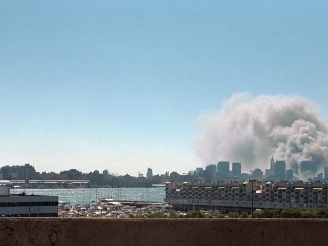 Smoke rises from the site of the World Trade Center, September 11, 2001. (P7127-23)