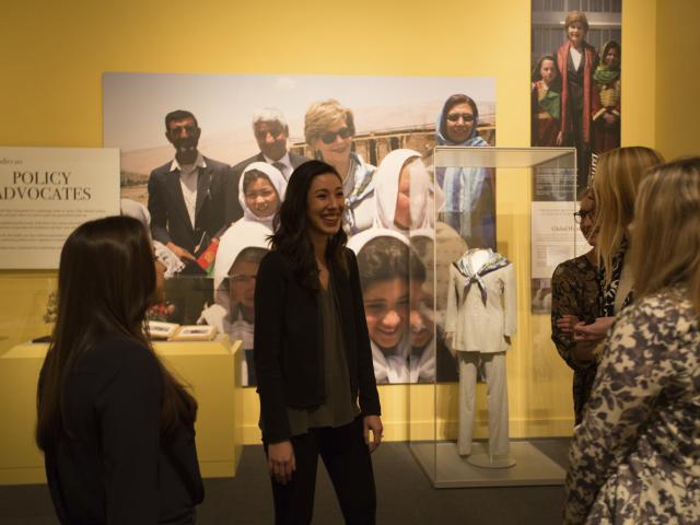 A picture of smiling visitors enjoying the 2018 First Ladies exhibit at the George W Bush Library and Museum