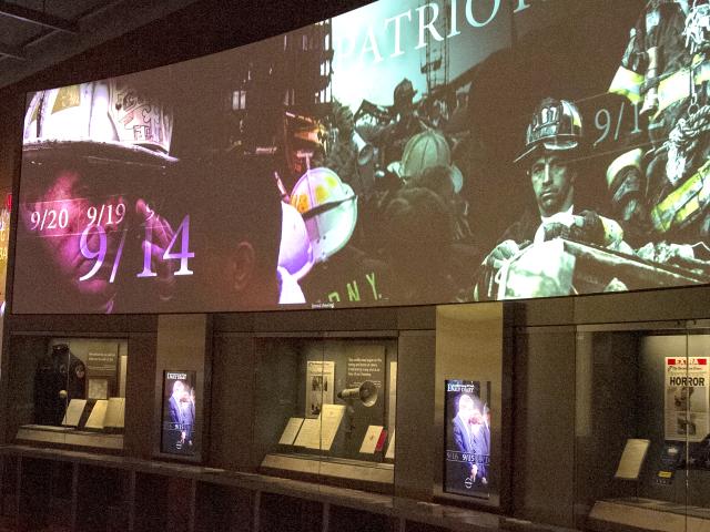 Monitors in the p/11 exhibit show archival news coverage