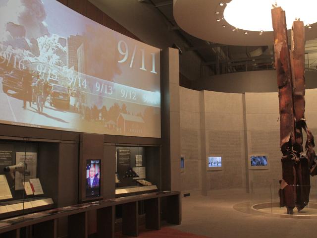 Monitors in the 9/11 Exhibit show archival news coverage.