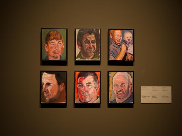 A photo of six individual portraits hanging on the wall, part of the 2017 Portraits of Courage exhibit at the George W Bush Library and Museum.