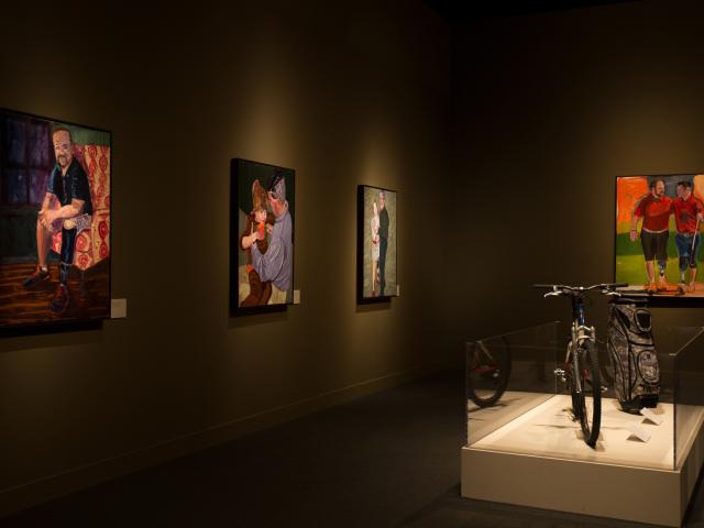 A photo of a room from the 2017 Portraits of Courage exhibit ta the George W Bush Library and Museum.