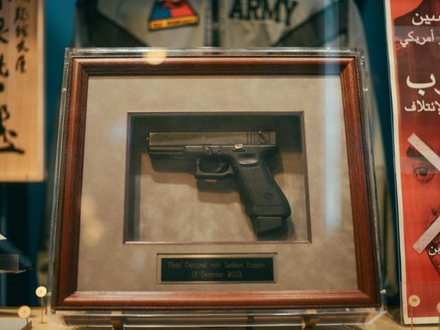 This 9mm Glock pistol was confiscated from Saddam Hussein when he was removed from the spider hole in Iraq. It is non-functional and was given to the President by the Military specialists who captured Saddam.