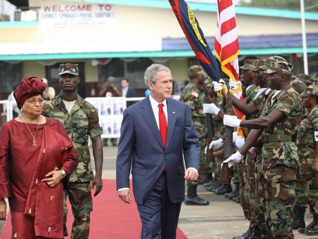 President Bush reviews troops with Liberian President Ellen Johnson Sirleaf