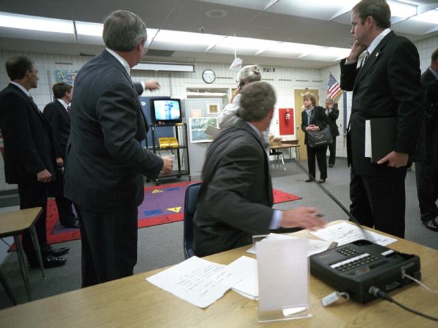 President George W. Bush watches news footage from Emma E. Booker Elementary School in Sarasota, Florida, of Flight 175 hitting the South Tower of the World Trade Center, September 11, 2001.