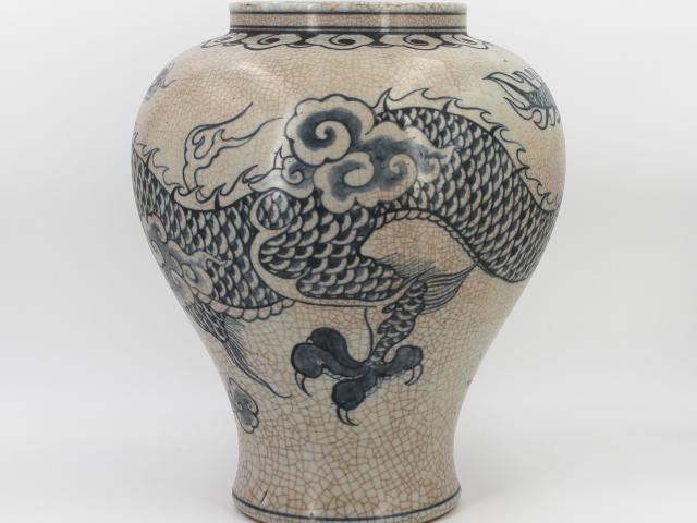 Speckled-brown vase decorated in blue with a continuous five clawed dragon and scattered flaming pearl devices. The form features a straight wide neck with a collared rim, made by Park, Kung Sun; signed on bottom. Gifted by Roh Moo-hyun, President of the Republic of Korea.