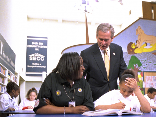 President Bush meets with volunteers and students after a speech about USA Freedom Corps