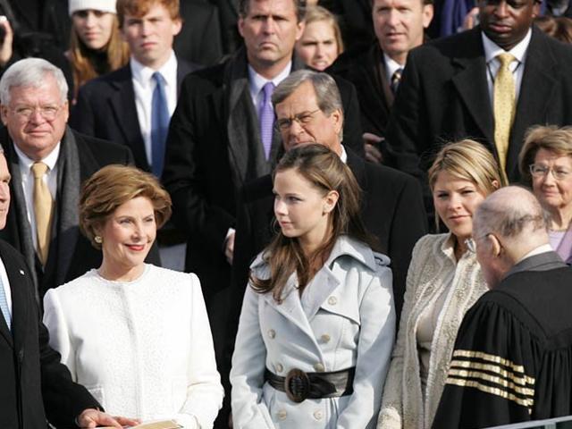 President George W. Bush places his hand on the Bible as he takes the oath of office