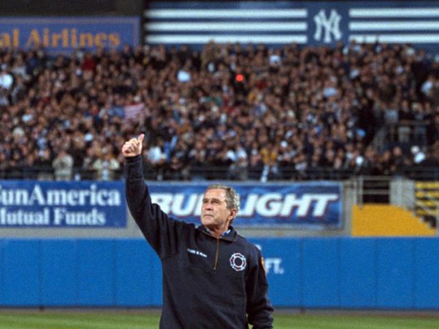 President George W. Bush gives a thumbs-up as he stands on the mound at Yankee Stadium.