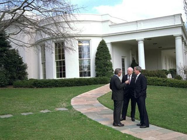 President George W. Bush meets with Vice President Dick Cheney and Secretary of Defense Donald Rumsfeld outside the Oval Office shortly after authorizing operation "Iraqi Freedom", March 19, 2003.