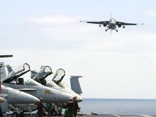 President George W. Bush approached the flight deck of the USS Abraham Lincoln in a S-3B Viking jet, May 1, 2003.