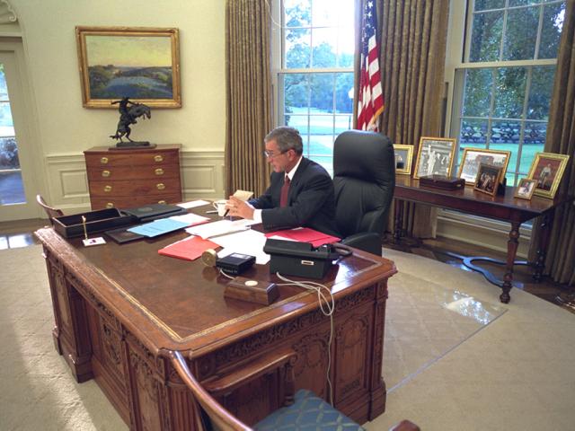President George W. Bush Works at the Resolute Desk in the Oval Office, September 13, 2001.