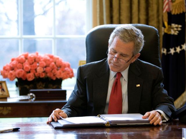 President George W. Bush reads over a draft of his State of the Union speech in the Oval Office Tuesday morning, January 31, 2006, in preparation for the annual address to the nation scheduled for that evening.