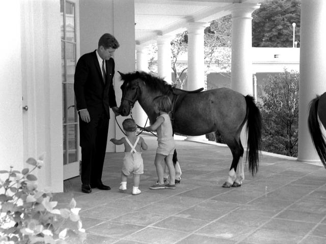 President Kennedy with Caroline Kennedy, John F. Kennedy, Jr., & Macaroni the pony, June 22, 1962. Robert Knudsen, White House Photographs. John F. Kennedy Presidential Library and Museum, Boston. KN-22365. 