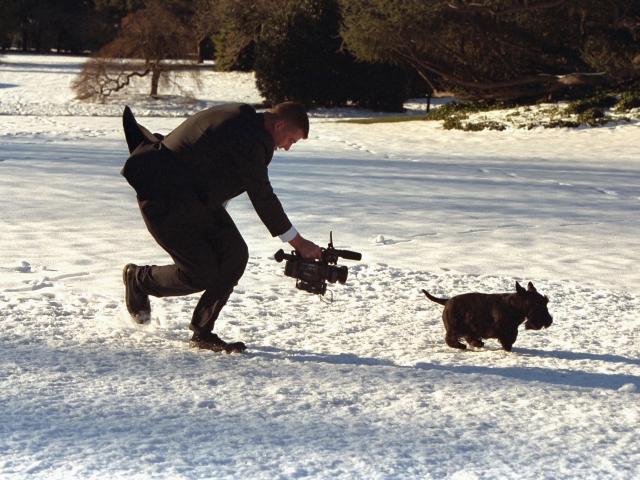 A videographer chases Barney across the South Lawn for a segment of the 2002 Barney Cam.  Photo by Paul Morse, George W. Bush Presidential Library. P24780-23.