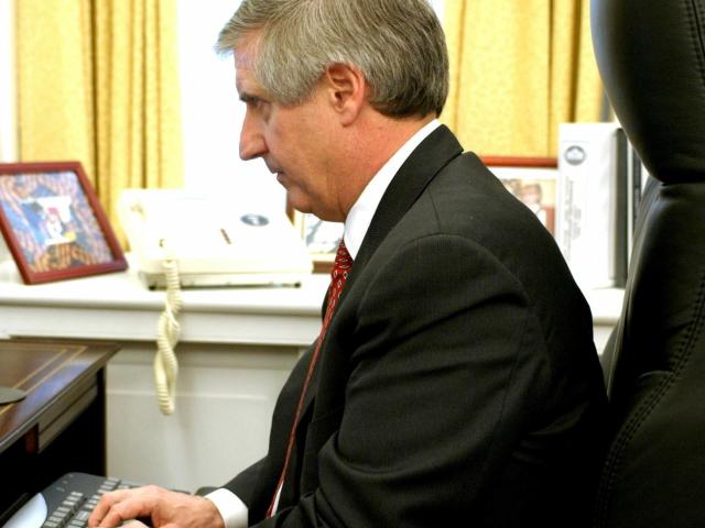 Chief of Staff Andy Card working at his desk.
