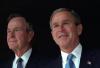 President George W. Bush poses with his father, former President George H. W. Bush, December 23, 2001, at Camp David in Thurmont, Maryland. (P11417-21)