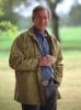President George W. Bush poses for artist Robert Anderson, a portrait painter and former Yale classmate, March 30, 2002, at Prairie Chapel Ranch in Crawford, Texas. (P15319-21A)