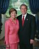 President George W. Bush and Mrs. Laura Bush stand in the Blue Room of the White House for an official portrait, June 4, 2002.