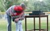 President George W. Bush offers a congratulatory hug as game balls are handed out.