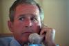 President George W. Bush talks on the telephone with Vice President Dick Cheney and others, September 11, 2001, during the flight from Sarasota, Florida to Barksdale Air Force Base in Louisiana. (P7071-29)