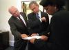 President George W. Bush looks over a briefing paper with Vice President Dick Cheney and National Security Advisor Dr. Condoleezza Rice, September 12, 2001, outside the Oval Office. (P7176-33)