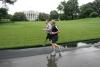 President George W. Bush runs with U.S. Army Staff Sergeant Christian Bagge of Oregon, on the South Lawn, June 27, 2006. President Bush met Sgt. Bagge at Brooke Army Medical Center January 1, 2006, where he promised to run with Sgt. Bagge.