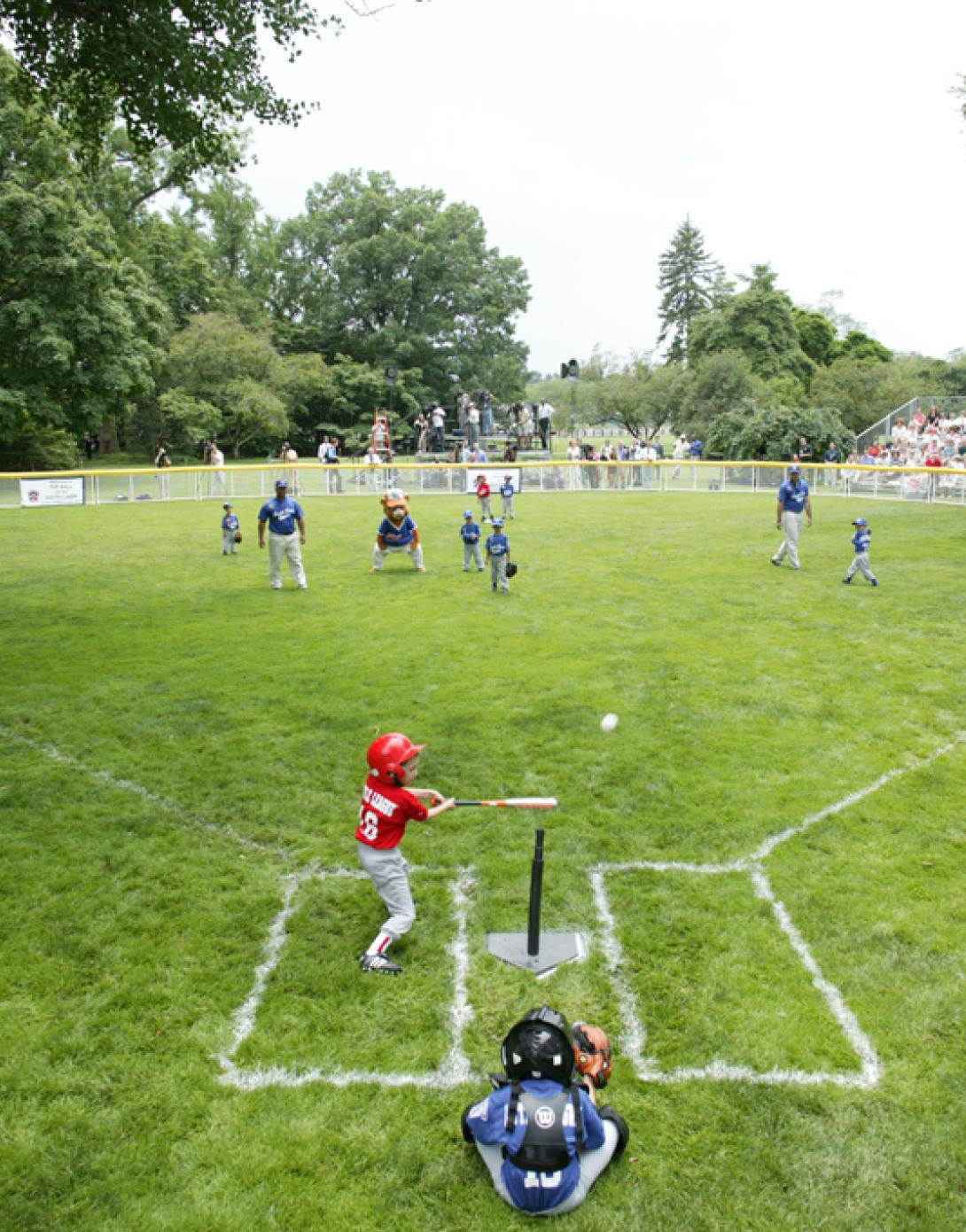 A McGuire Air Force Base Yankee leads off with a hit during Tee Ball against the Dolcom Little League Indians at the White House.