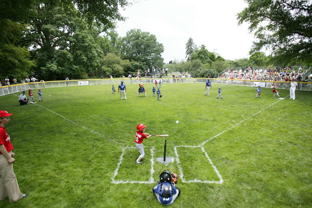 A McGuire Air Force Base Yankee leads off with a hit during Tee Ball against the Dolcom Little League Indians at the White House.