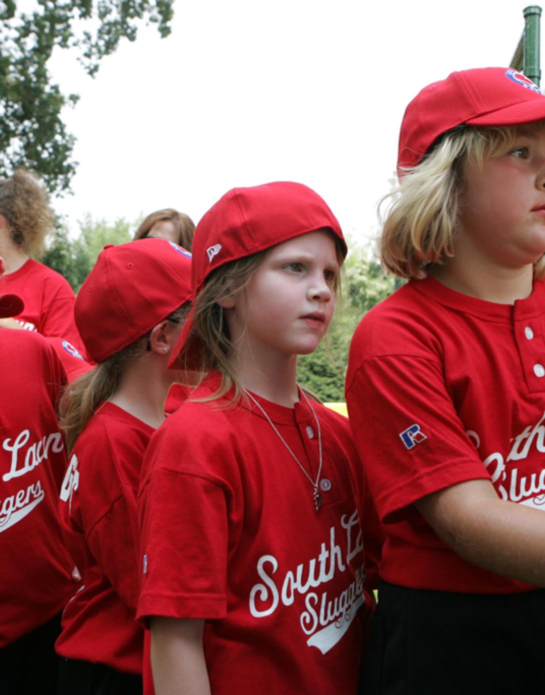 Members of the Luray, Virginia Red Wings watch from the bench.