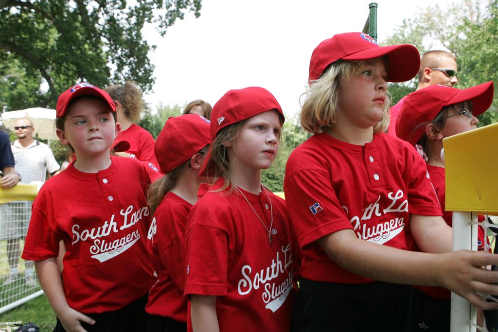 Members of the Luray, Virginia Red Wings watch from the bench.