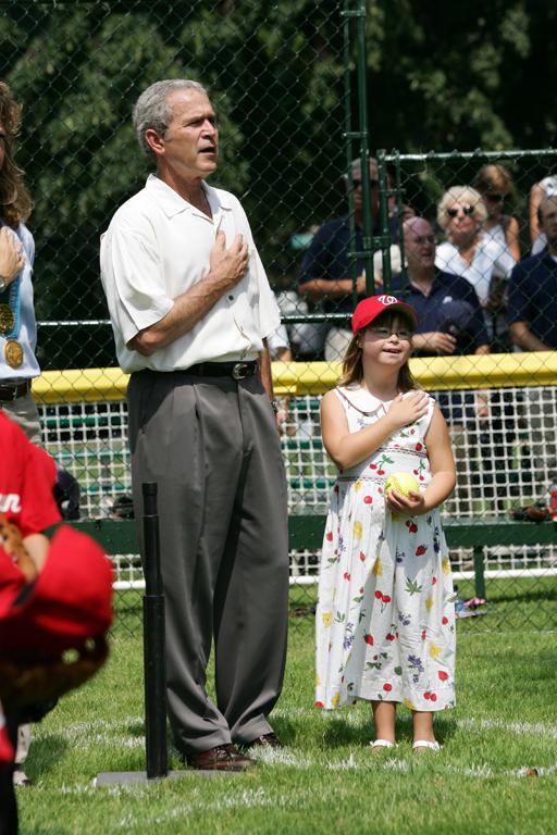 President George W. Bush is joined for the singing of the national anthem by Meredith Cripe.