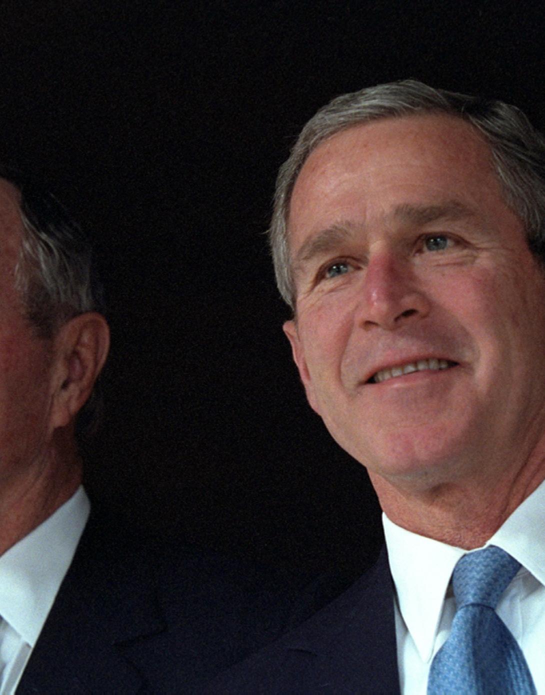 President George W. Bush poses with his father, former President George H. W. Bush,  December 23, 2001, at Camp David in Thurmont, Maryland. (P11417-21)