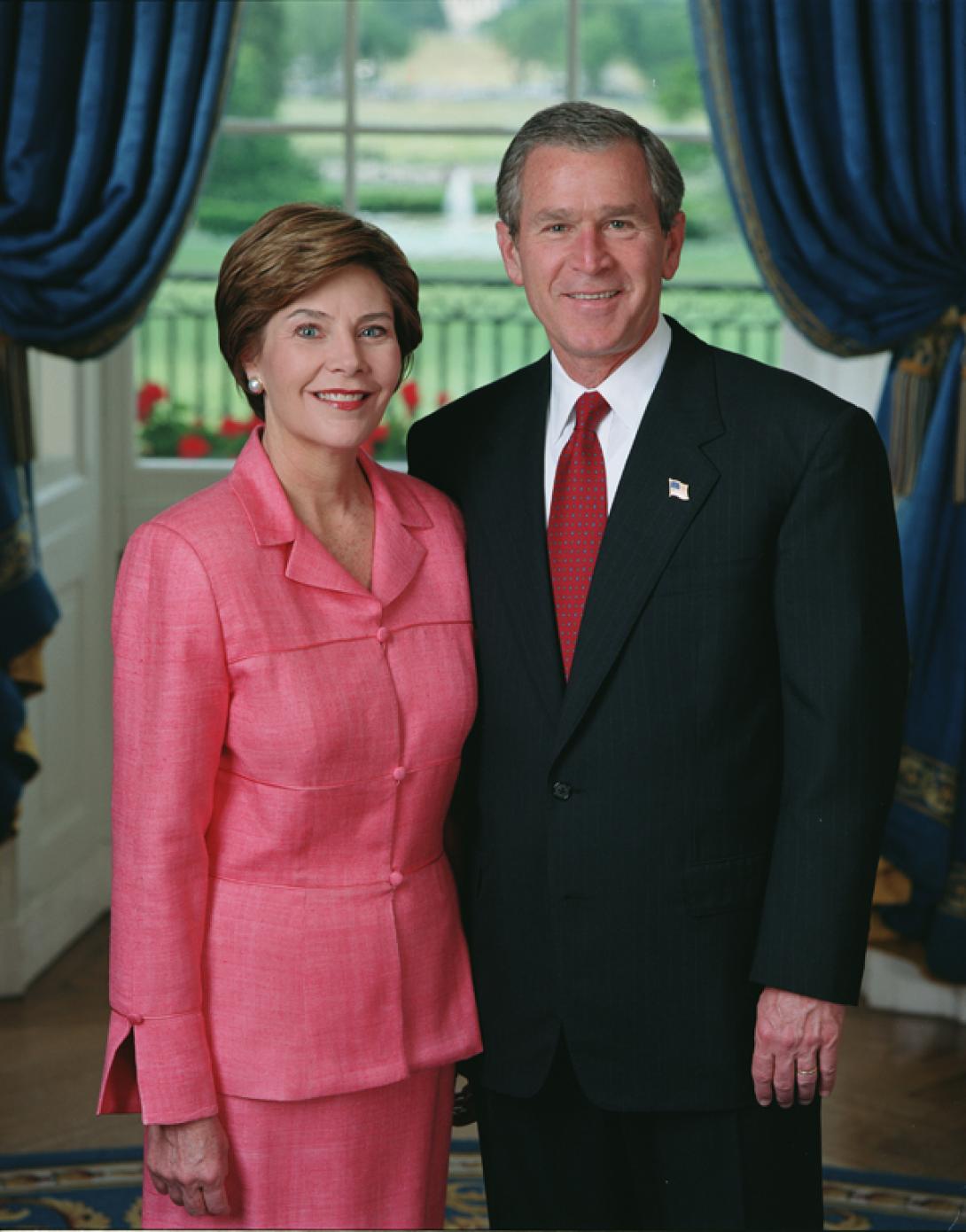 President George W. Bush and Mrs. Laura Bush stand in the Blue Room of the White House for an official portrait, June 4, 2002.