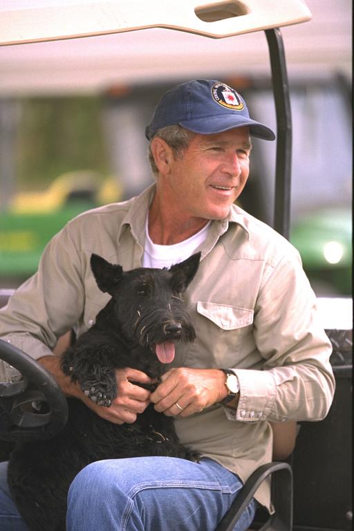 President George W. Bush sits with Barney, August 27, 2002, at Prairie Chapel Ranch in Crawford, Texas. (P20871-12A)