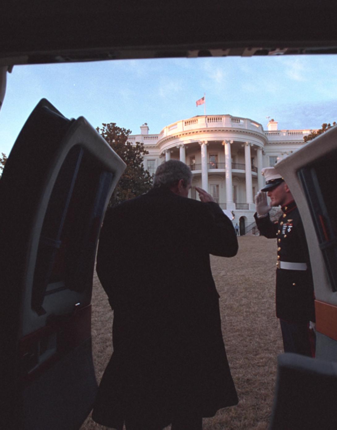 President George W. Bush salutes, February 4, 2001, as he disembarks Marine One on the South Lawn of the White House. (P336-07)